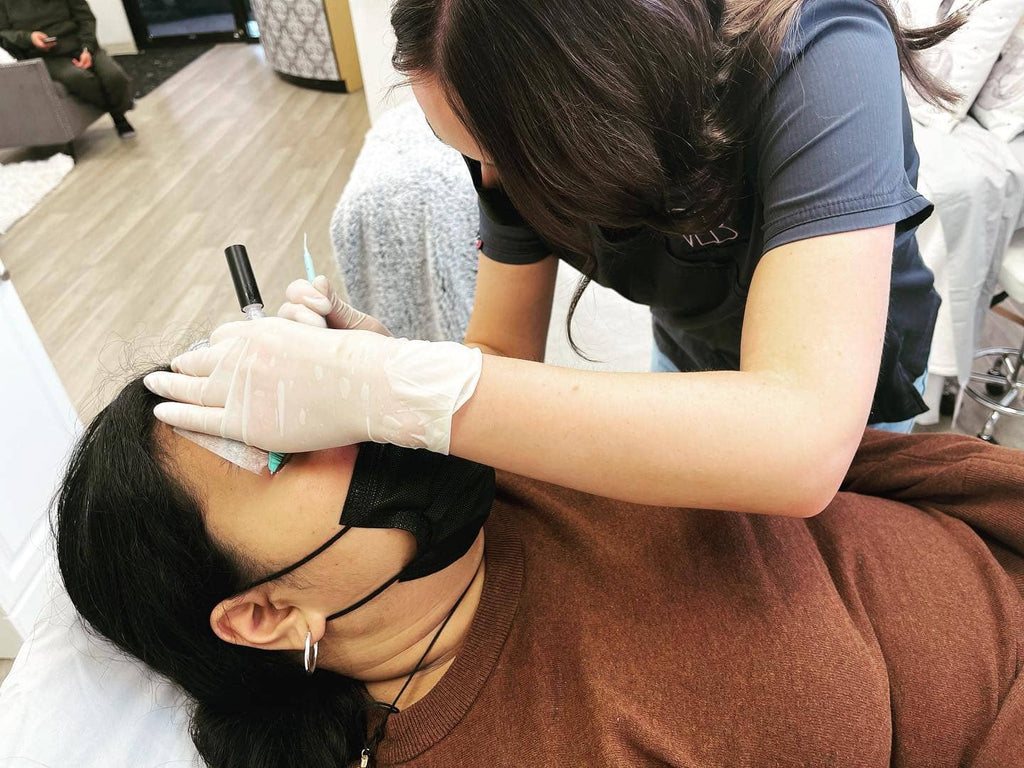 Vela Lash Bar lash lift and tint certification course in progress with a student practicing on a model