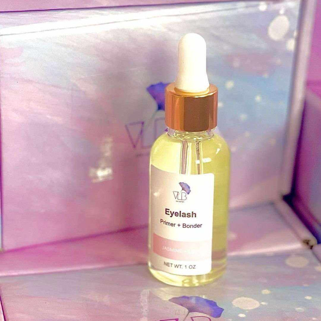 Vela Lash Bar Eyelash Extension Primer in a glass bottle with dropper for flawless lash application