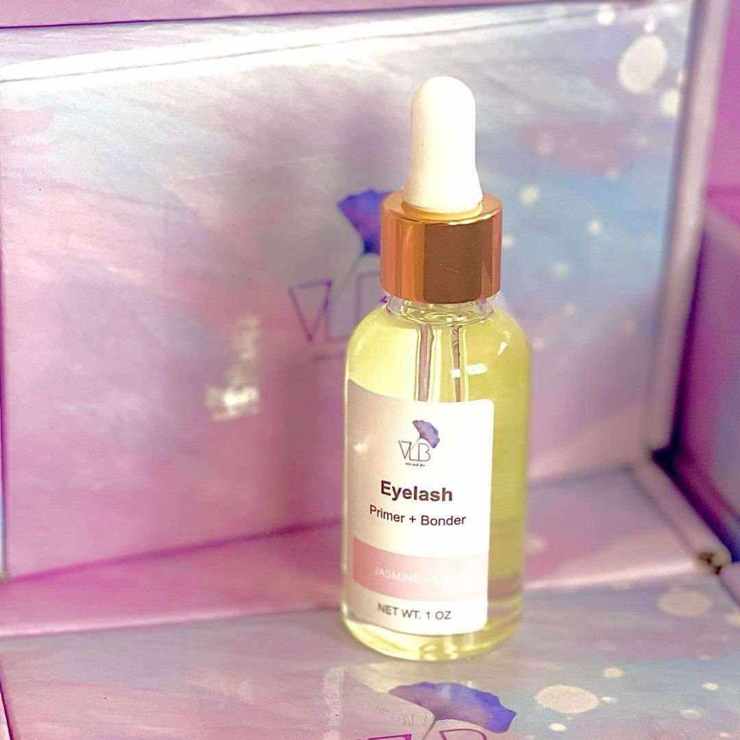 Vela Lash Bar Eyelash Extension Primer in a glass bottle with dropper for flawless lash application
