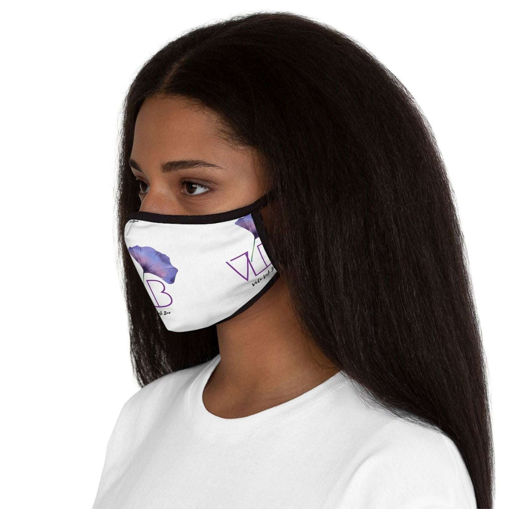 Woman wearing a comfortable face mask for beauty by Vela Lash Bar with floral design